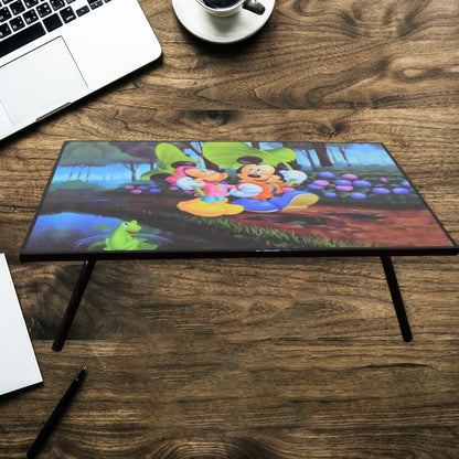 A vibrant cartoon-printed kids study table with foldable legs, perfect for learning and play.