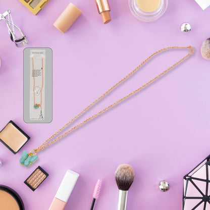 Full view of the charm chain necklace displaying multiple playful designs.