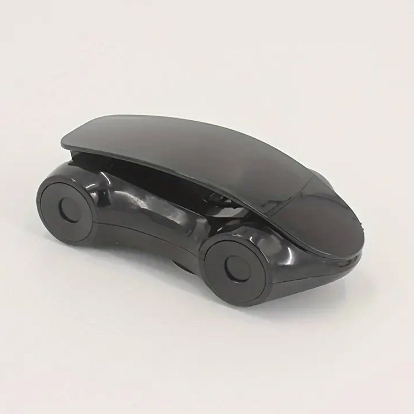 Stylish red sports car phone holder positioned on a car dashboard.