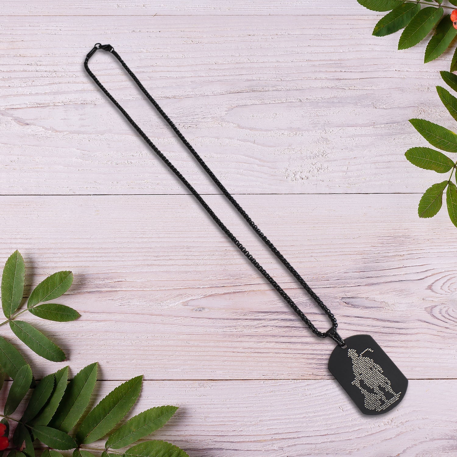 The religious necklace with the Hanuman Chalisa Locket displayed on a flat surface.