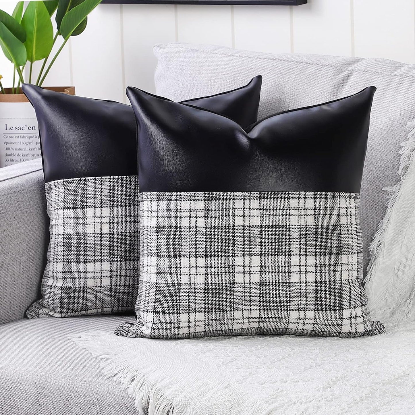 Close-up of a pair of Styleva Leather & Cotton Pillow Covers with elegant texture.