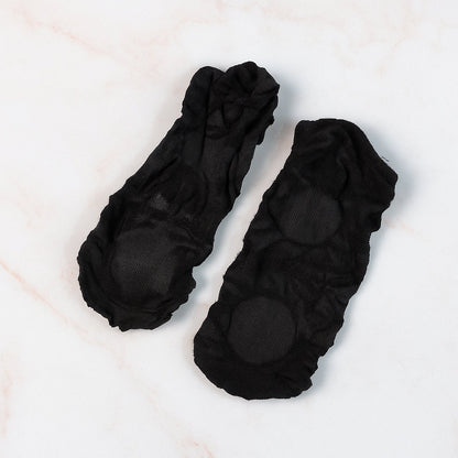 Pair of no-show liner socks laid flat, showing minimal coverage