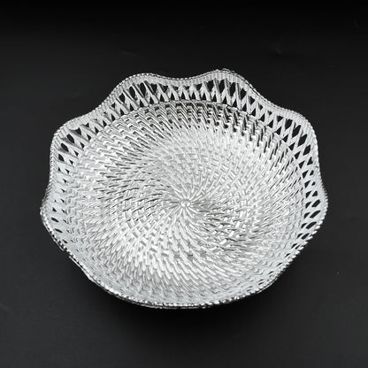 An empty round plastic tray showcasing its traditional design.