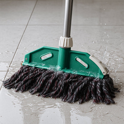Cotton mop refill attached to sturdy rod for floor cleaning