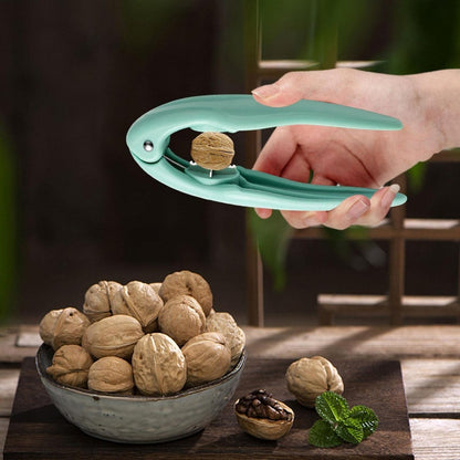 NutEase opener clip for quick and easy shelling of various nuts in kitchen.