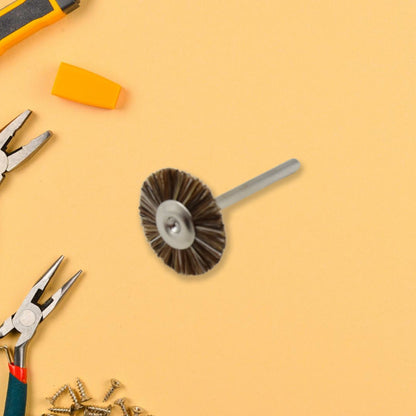A shank-mounted brass wire brush, ideal as a drill attachment for metal grinding.
