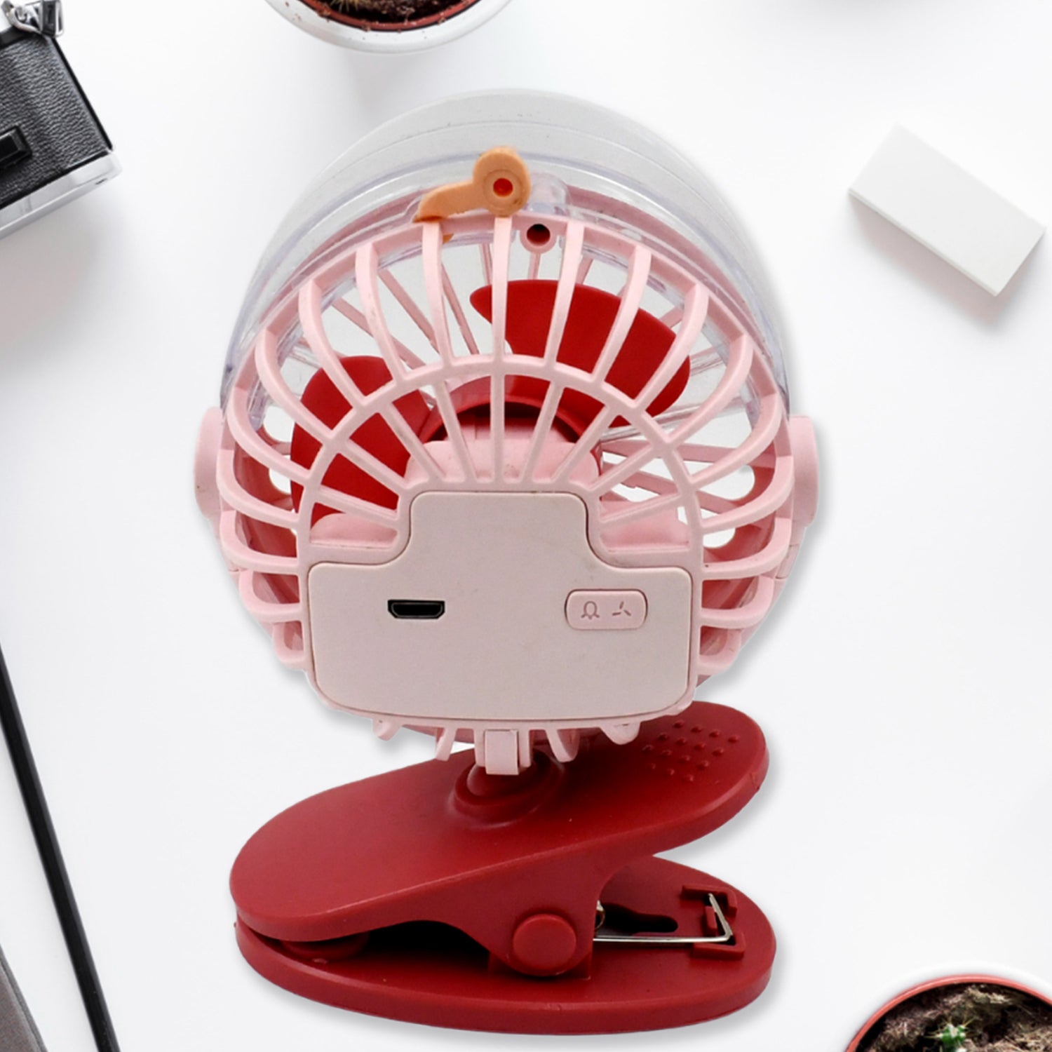 USB table fan demonstrating its 360-degree rotation capability.
