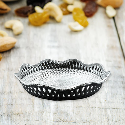 Multipurpose round platter for serving dry fruits and snacks.