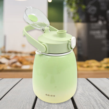 The 1200ml travel mug with its lid open, revealing a straw and included sticker sheet.