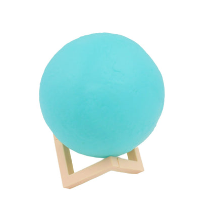 The Moon Night Lamp's durable plastic stand provides stable support for the spherical light.