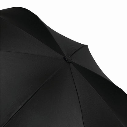 Kids umbrella compactly folded with a secure carrying strap.