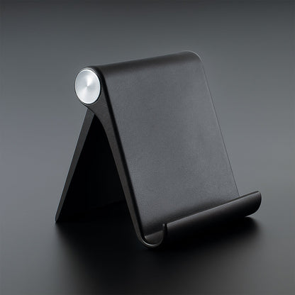 Foldable mobile stand showing adjustable angle on a study table