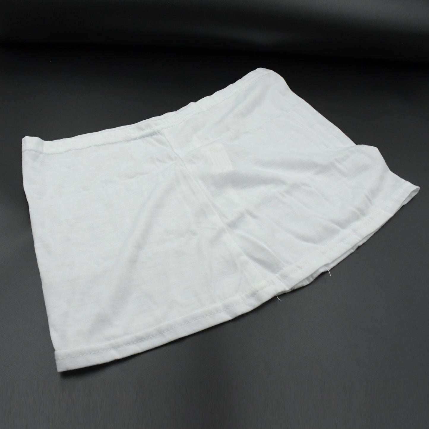 Women's high-waisted athletic skort front view in white.