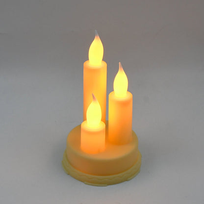 Decorative LED taper candles arranged elegantly on a table, creating a festive ambiance.