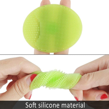 Pair of soft silicone facial cleansing brushes, highlighting their compact size.