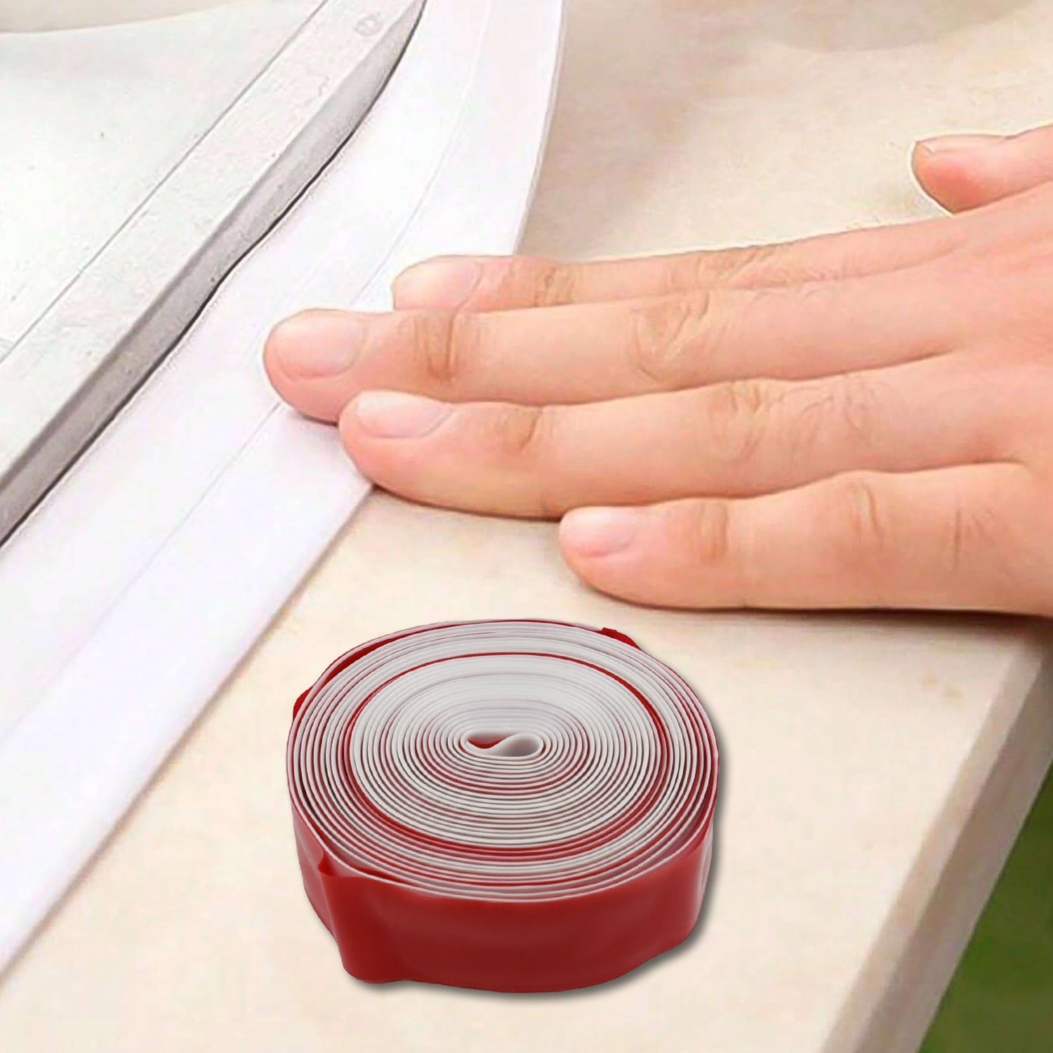Easy-to-apply self-adhesive caulk tape protecting kitchen corners.