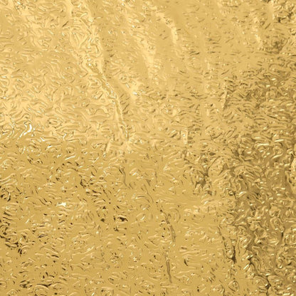 Close-up of a self-adhesive golden kitchen foil sticker roll.