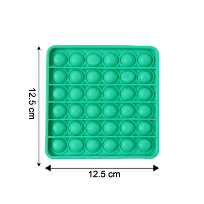 Close-up of popping bubbles on silicone Pop It toy