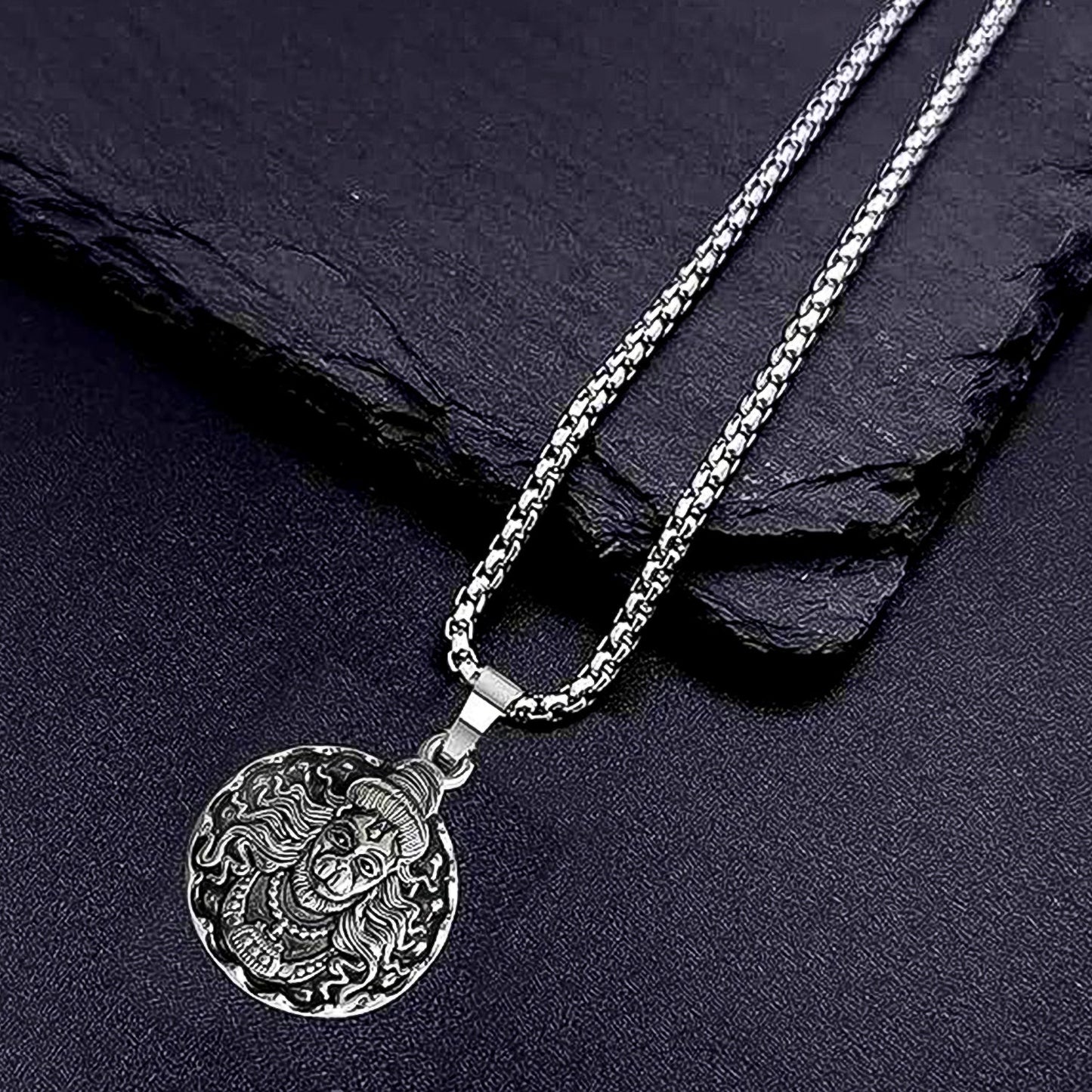 Detailed view of the Hanuman Locket with its accompanying chain.