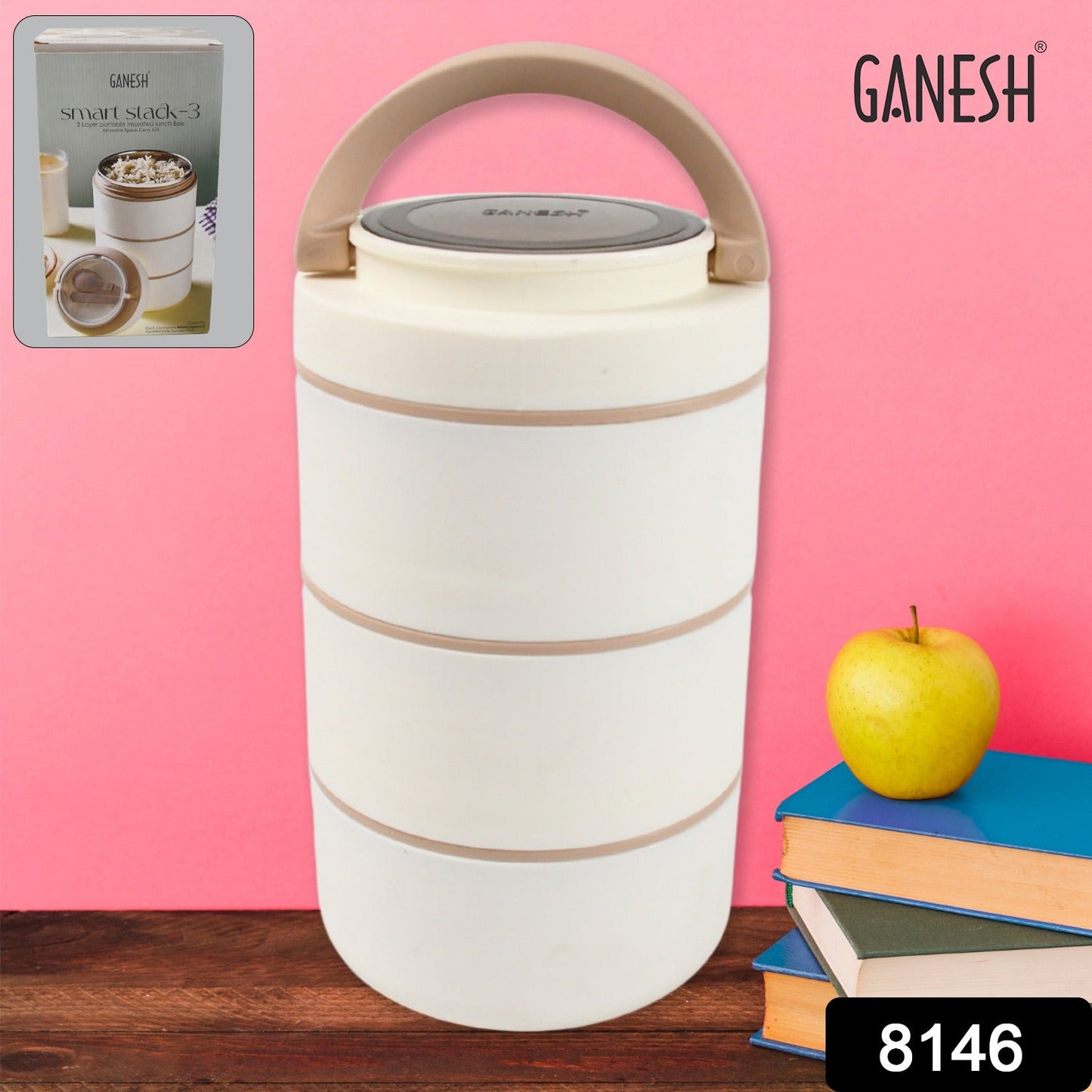 The Ganesh Smart Stack stainless steel lunch box displayed with an apple and a fork, suggesting a healthy meal.