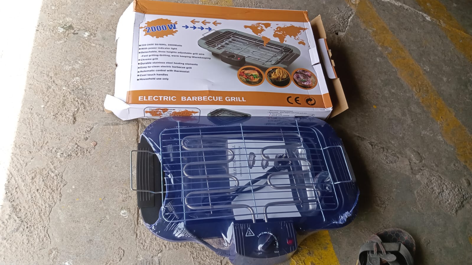 Side view of the portable electric barbecue grill, showcasing its sleek design.