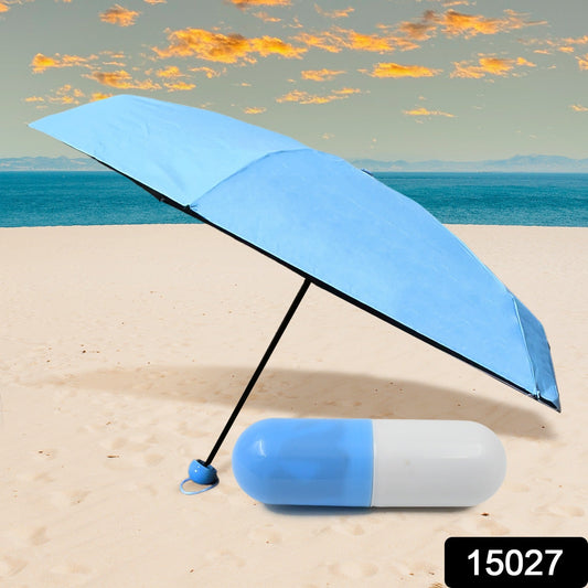 An open DrizzlePro compact umbrella providing ample rain protection in a city environment.