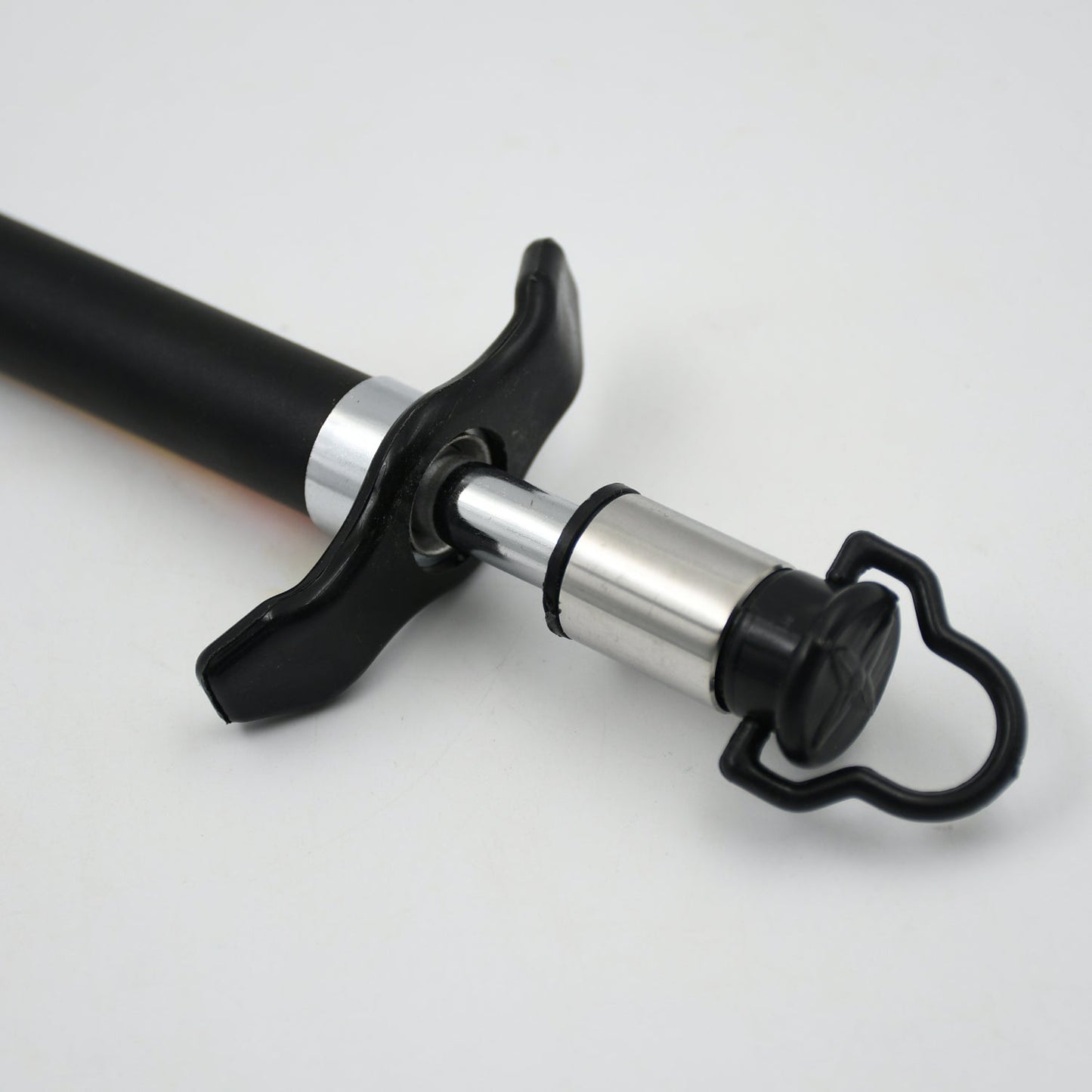Close-up of the stainless steel gas lighter producing a reliable spark for ignition.