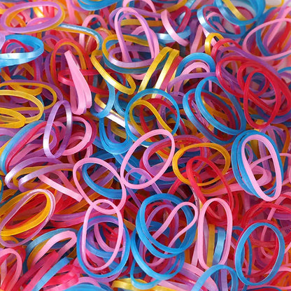 A neatly stacked pile of colorful multicolor rubber bands on a clean white background.