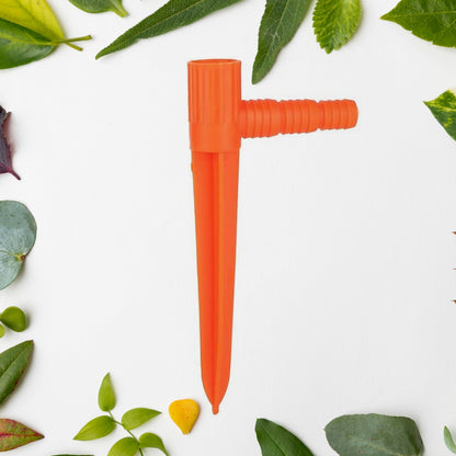 The garden sprinkler demonstrating its wide-area water spray coverage on a lawn.