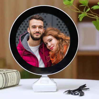 LED Magic Mirror Photo Frame glowing with a picture inside, on a white table.