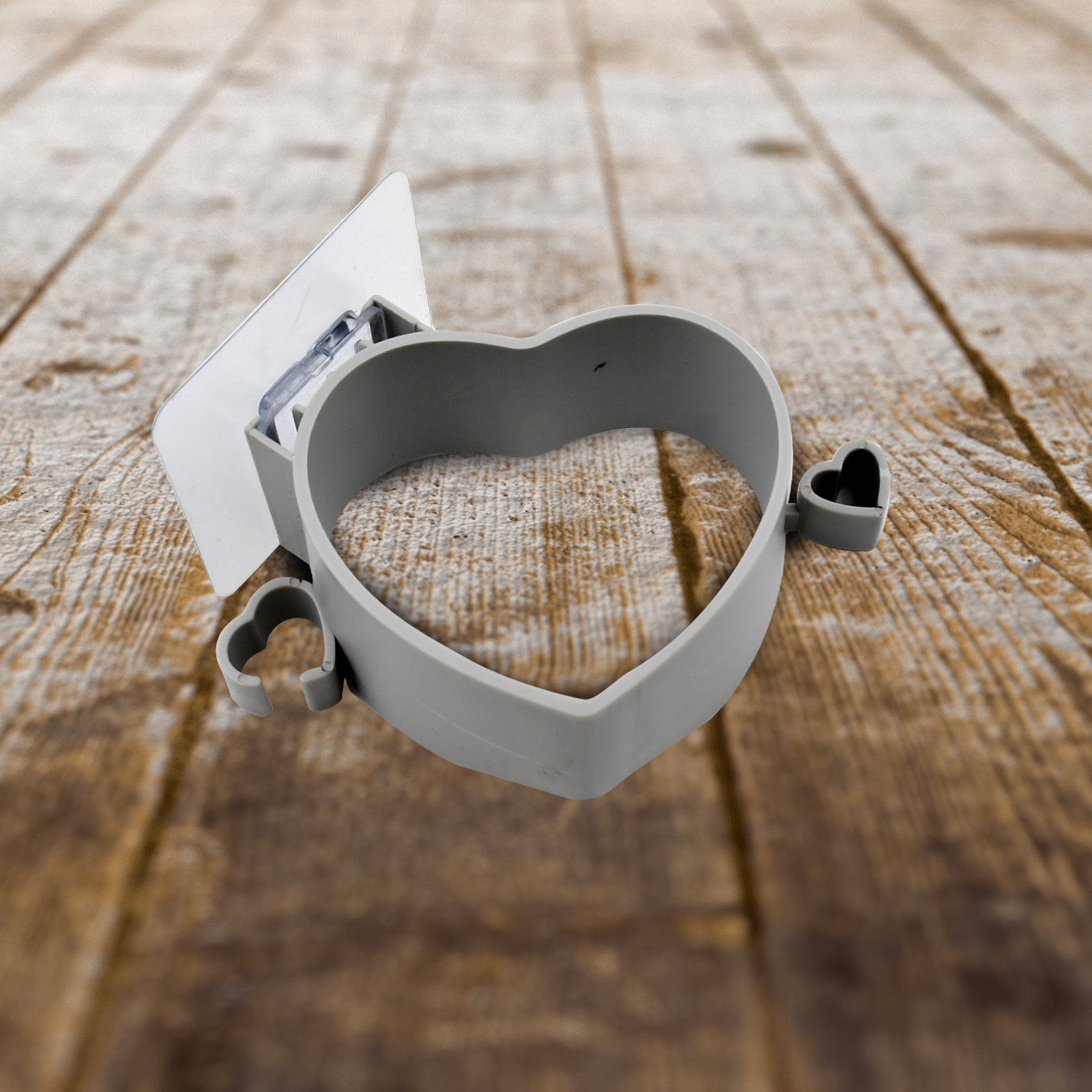 View of the versatile hair dryer holder with a hair dryer and plug stored.