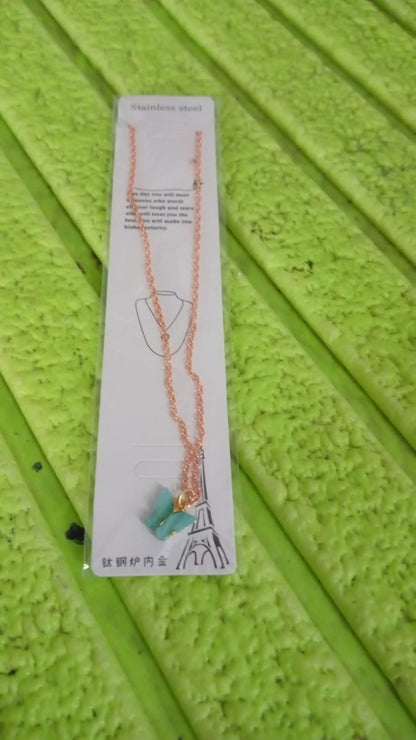 Model wearing the fashionable charm chain necklace, perfect for gifting.