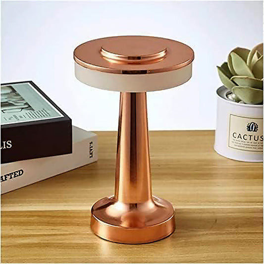 Modern LED desk lamp with touch control and warm light on a wooden surface.