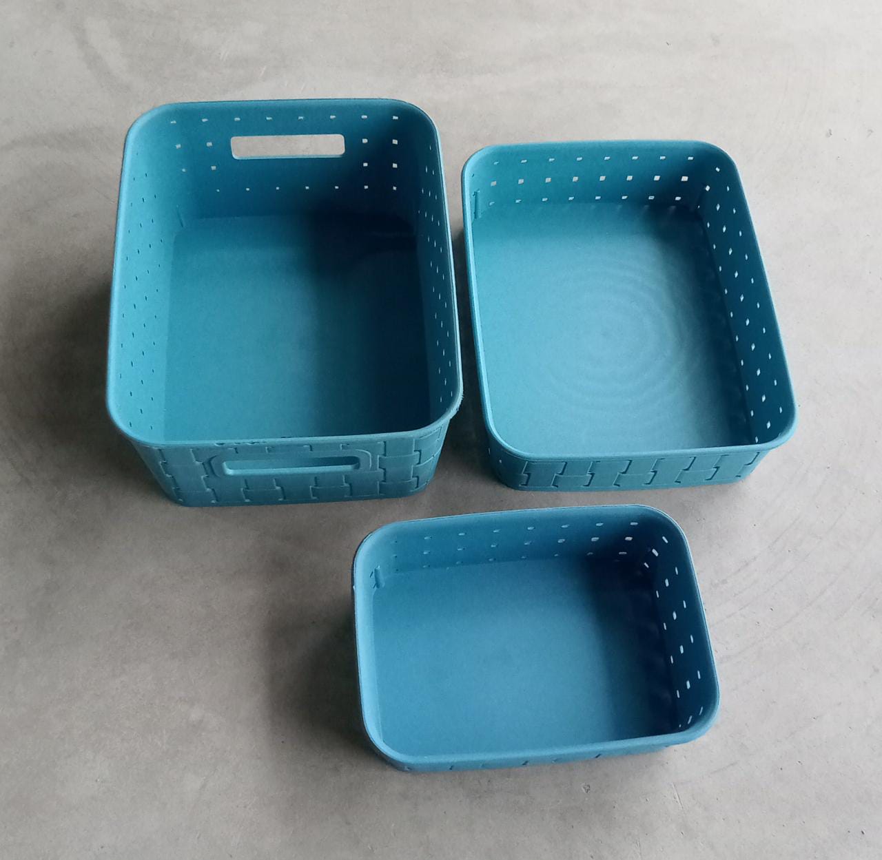 The complete set of three sky blue storage baskets from Organivo.