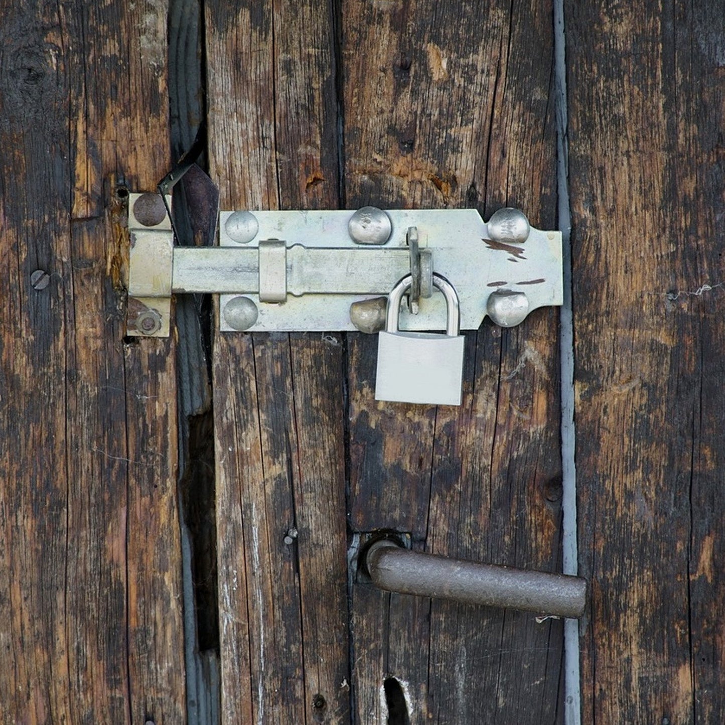 Safelix 60mm solid padlock securing a home door for enhanced security.