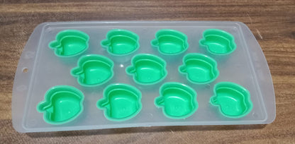 Refreshingly cool fruit-shaped ice cubes floating in a drink.