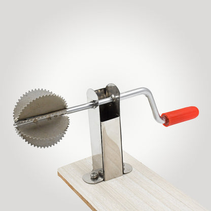 Close-up view of the Quickslice stainless steel coconut scraper's grating surface.