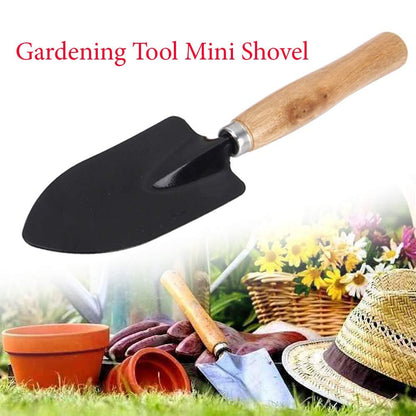 Ergonomic steel hand trowel with a black handle, ready for planting.