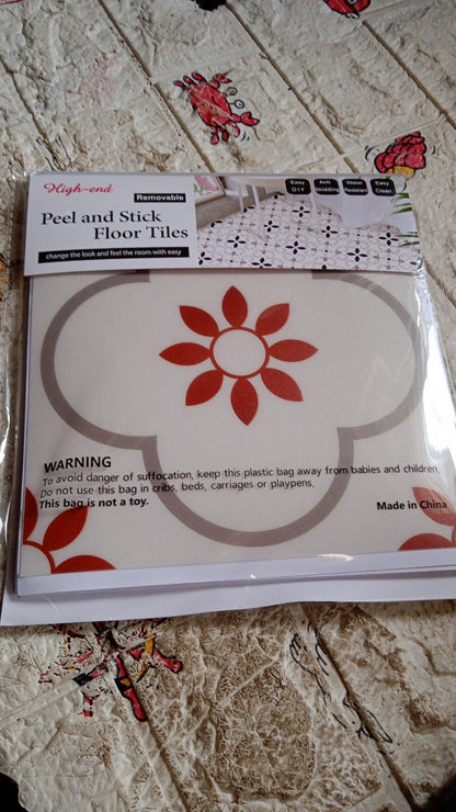 Stack of waterproof vinyl tile sticker sheets ready for home decoration projects.
