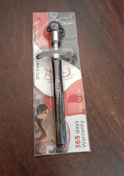 Hand holding the CookAura stainless steel gas lighter, ready to ignite a stove.