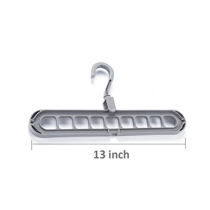 Close-up view of the nine precisely designed holes on the plastic hanger for secure garment storage.