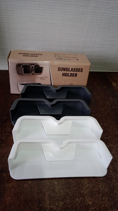 Vertical display of wall mounted sunglasses holders, ideal for maximising space and keeping eyewear tidy.