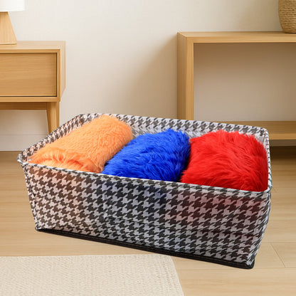 The canvas storage basket neatly folded flat, demonstrating its space-saving design for easy storage.