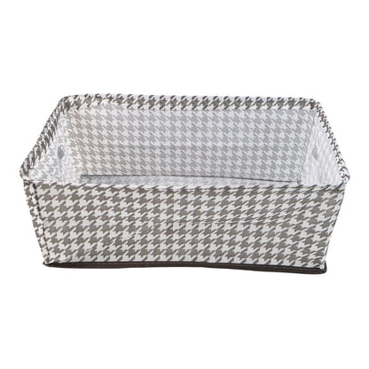 A minimalist-designed foldable canvas storage basket filled with soft linens, enhancing room aesthetics.