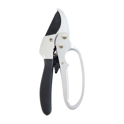 Gardening pruning shears actively cutting a small tree branch with precision.