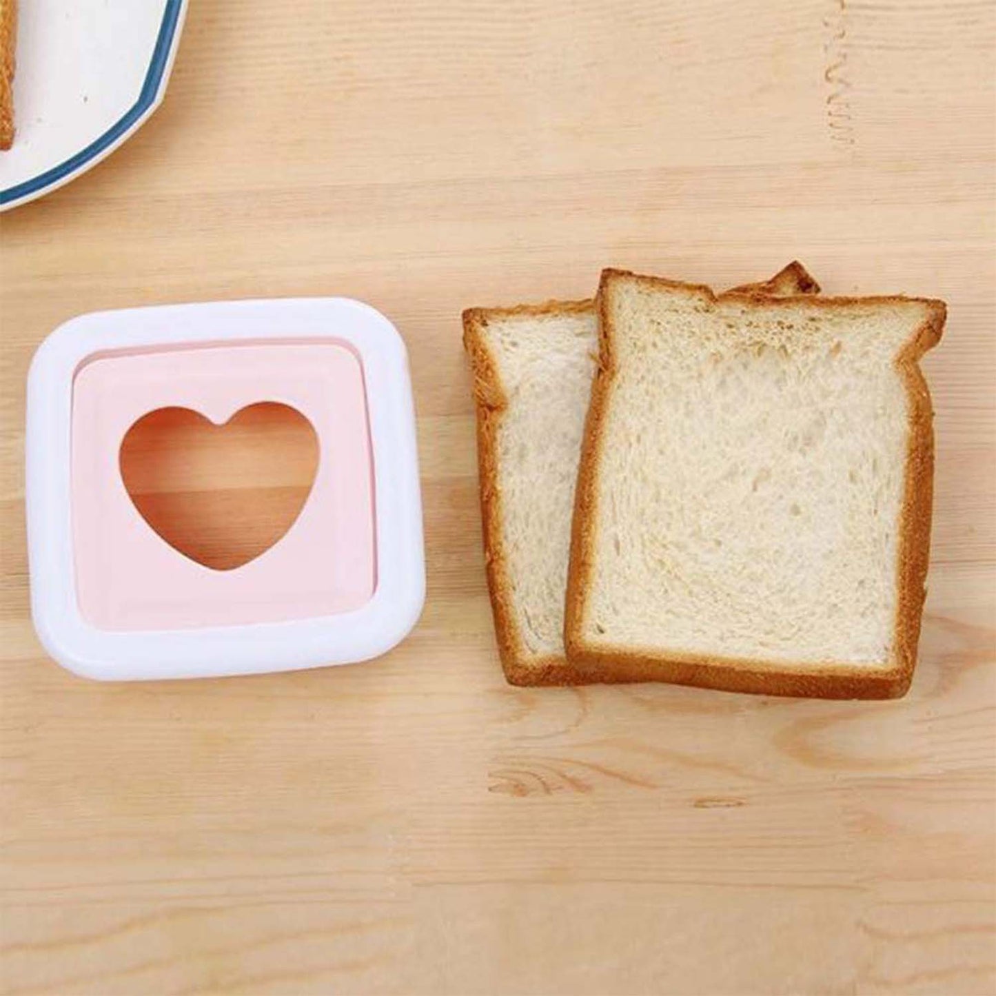 Bread slice with heart shape cut made by sandwich cutter