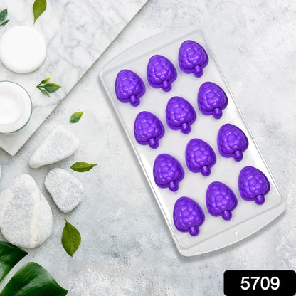 Close-up of vibrant fruit-shaped ice cubes made from the silicone mold.
