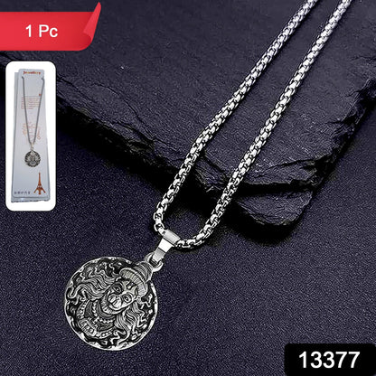 Round silver Hanuman pendant necklace on a plain background.