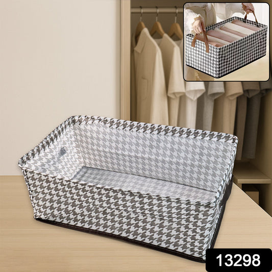 Stylish fabric storage bin placed on a wooden shelf, perfect for organizing clothes or linens.