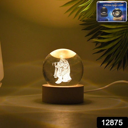Close-up of Radha Krishna 3D crystal ball night light with intricate laser etching.